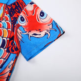 Colorful fabric with red fish face and blue background design.