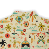 Beige shirt with colorful tropical patterns and skulls.
