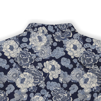 Detailed view of white and blue flowers on a navy background shirt.