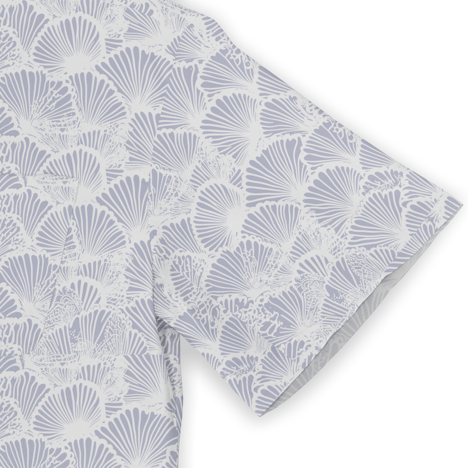 Light blue and white fabric with a repeating shell pattern, folded.