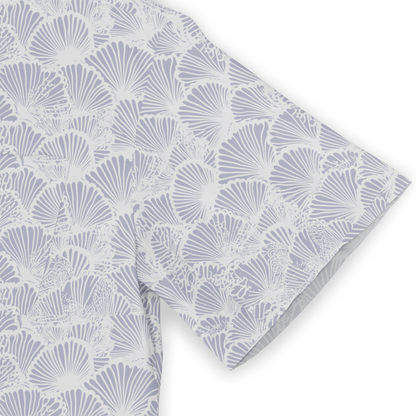 Light blue and white fabric with a repeating shell pattern, folded.