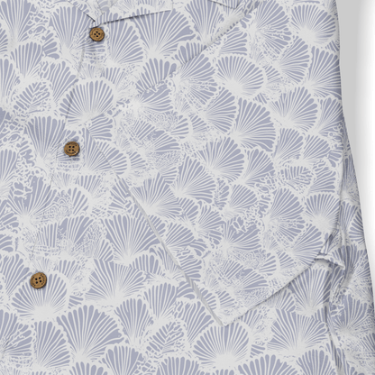 Light blue shirt with white fan patterns and brown buttons.