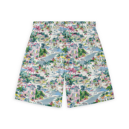 A pair of shorts featuring a vibrant coastal scenery design, including palm trees, houses, and boats on a light-colored background, evoking the charm of a seaside escape.