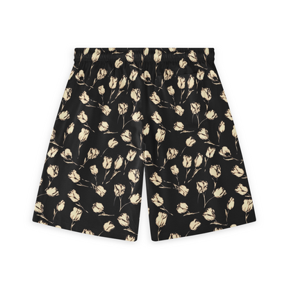 A pair of shorts featuring a design with delicate, light-colored flowers on a black background, creating a subtle yet striking contrast.