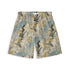 Front view of a pair of shorts featuring a vintage floral pattern with yellow flowers, blue leaves, and black accents on a beige background, offering a classic and detailed design.