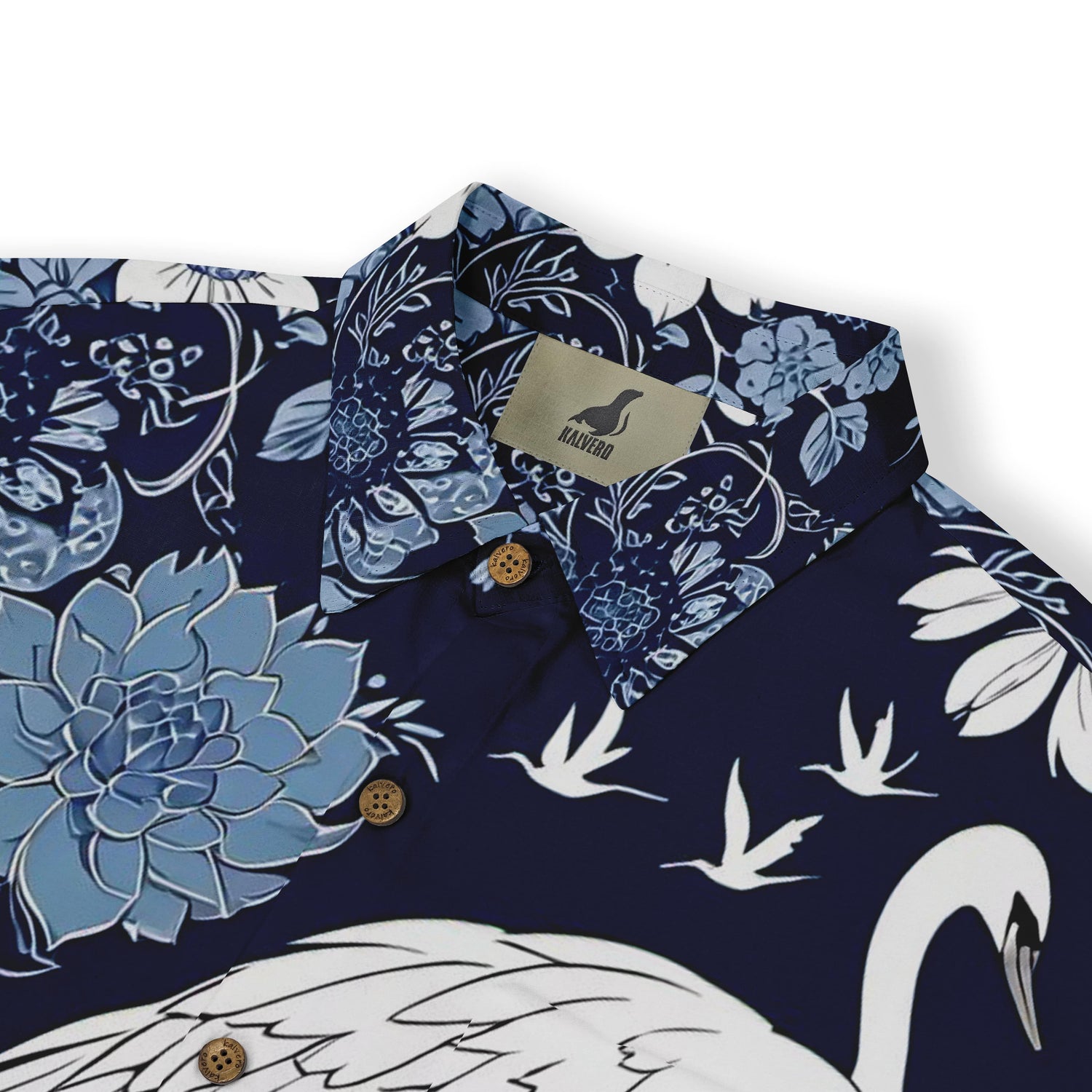 Blue and white shirt with a graceful crane motif, surrounded by delicate flowers.