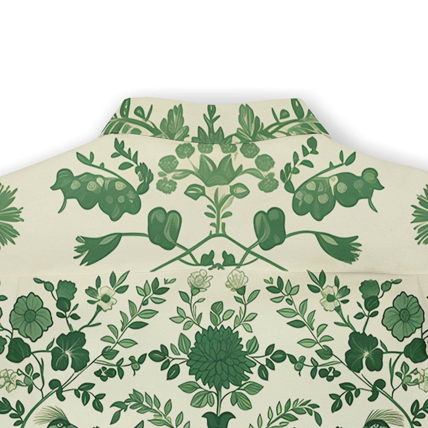 Green floral pattern on cream fabric, folded neatly.