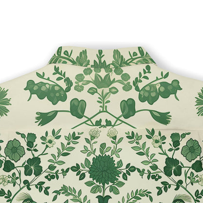 Green floral pattern on cream fabric, folded neatly.
