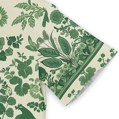 Nature-themed shirt featuring green botanical elements and bird motifs.