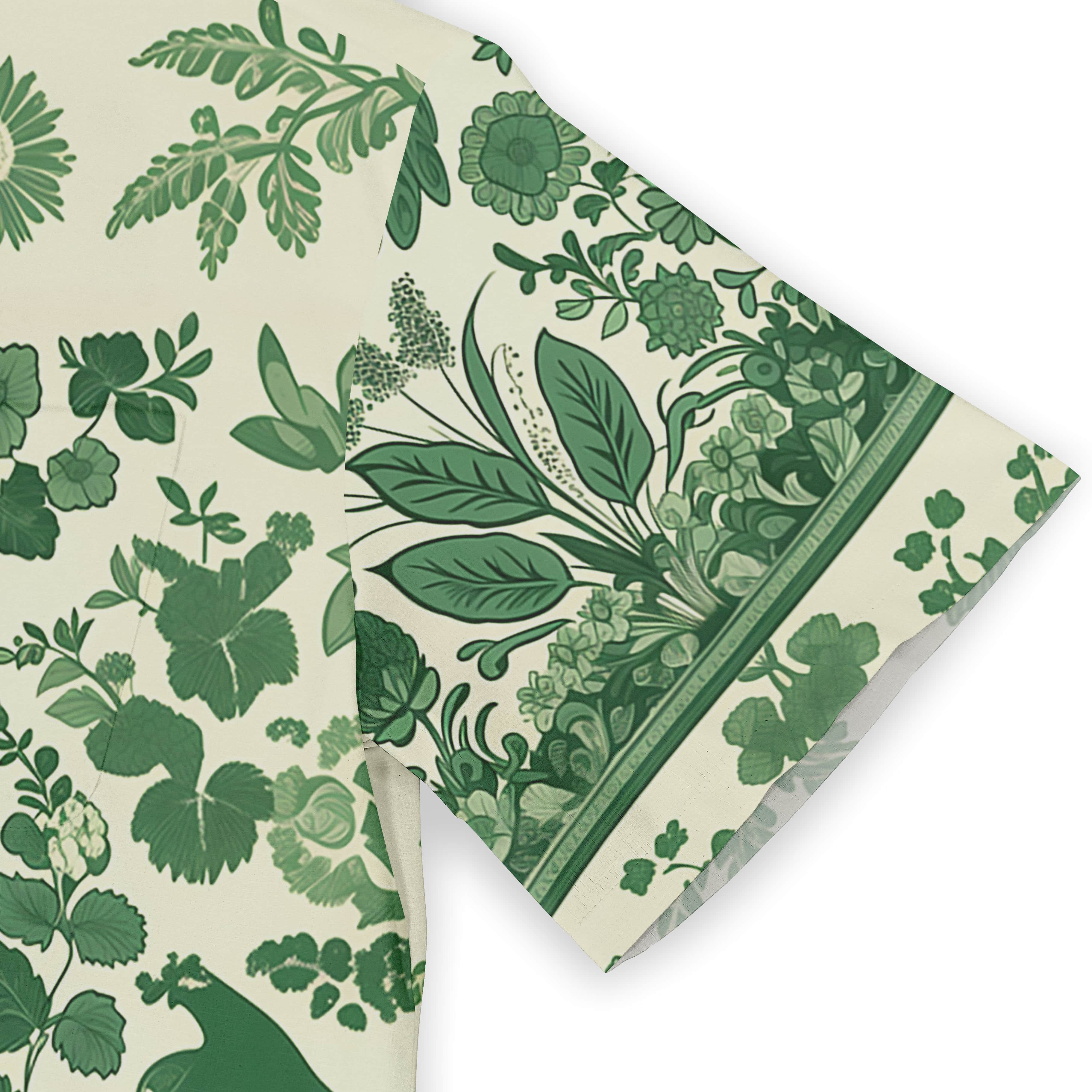 Green floral fabric with leaves and flowers on cream background.
