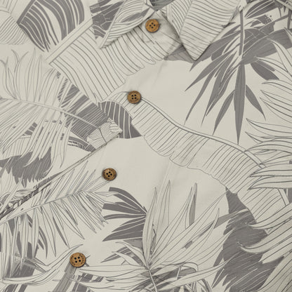 Gray and white tropical leaf pattern shirt with wooden buttons.