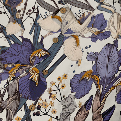Floral shirt with purple and white flowers, brown buttons.