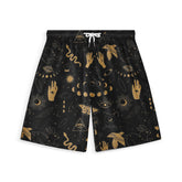 Dark blue shorts with gold mystical patterns including moons, eyes.