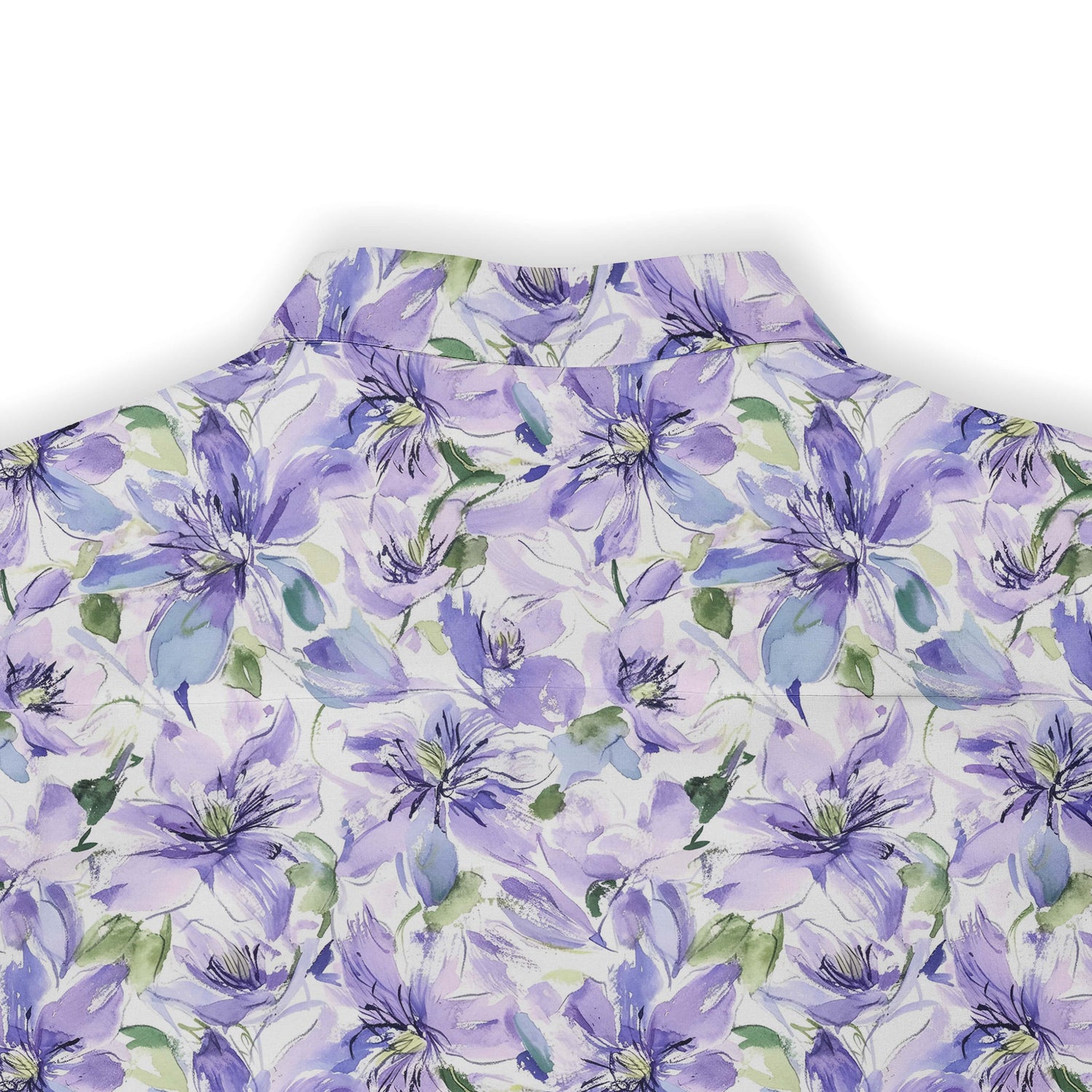 Purple floral pattern on white fabric, close-up view.