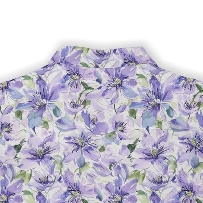 Purple floral pattern on white fabric, close-up view.