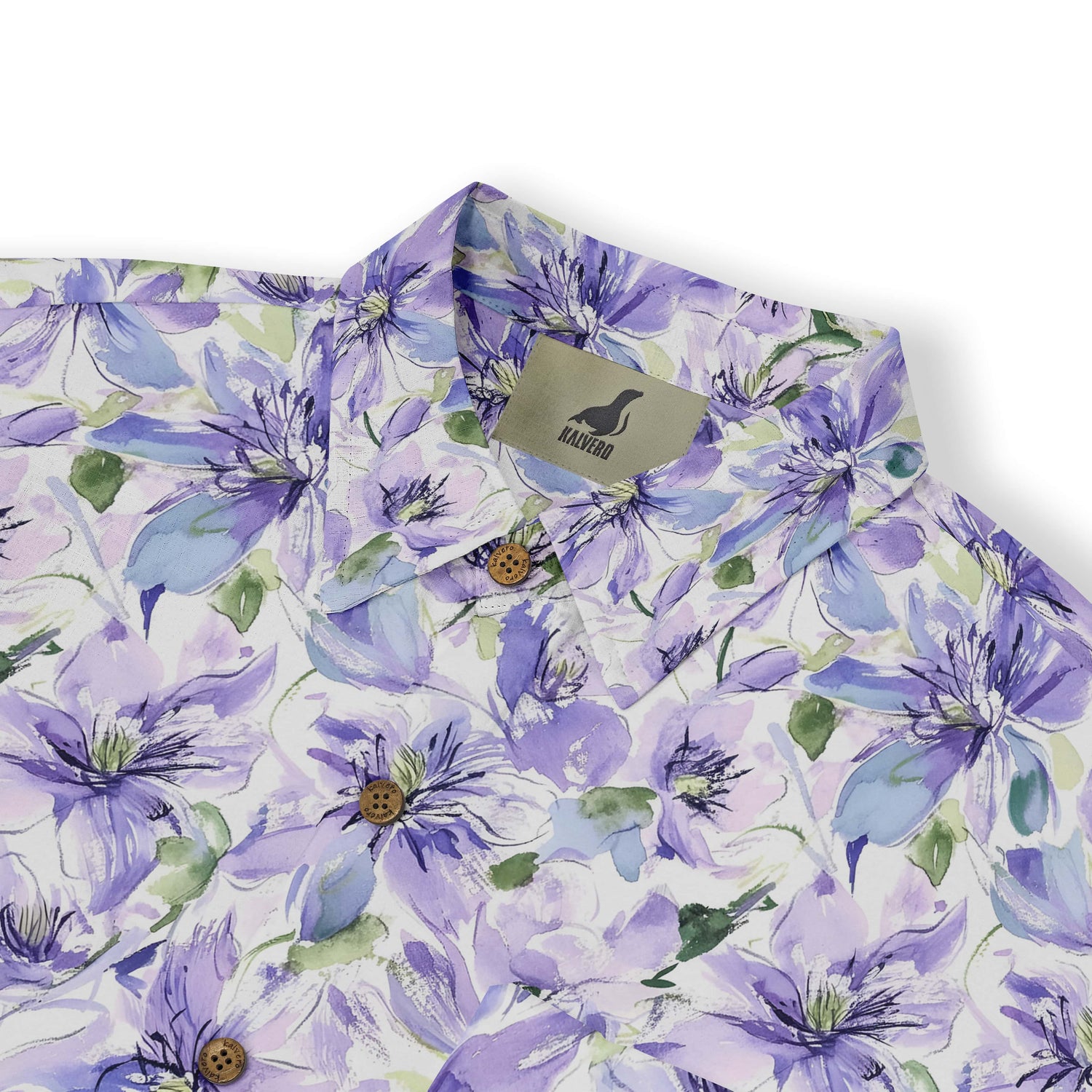 Close-up of a lavender flower design on a pastel-colored shirt.