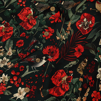 Dark fabric with red flowers, birds, and leaves pattern.