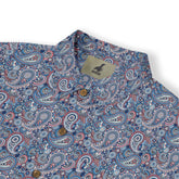 A classic paisley shirt with intricate floral details in blue, red, and green, dyed with natural indigo and madder root front view