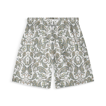 A pair of shorts featuring a design with intricate paisley patterns in soft shades of green, beige, and gold on a white background, creating a classic and elegant look.