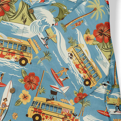 Hawaiian shirt with surfers, buses, flowers, and waves design.