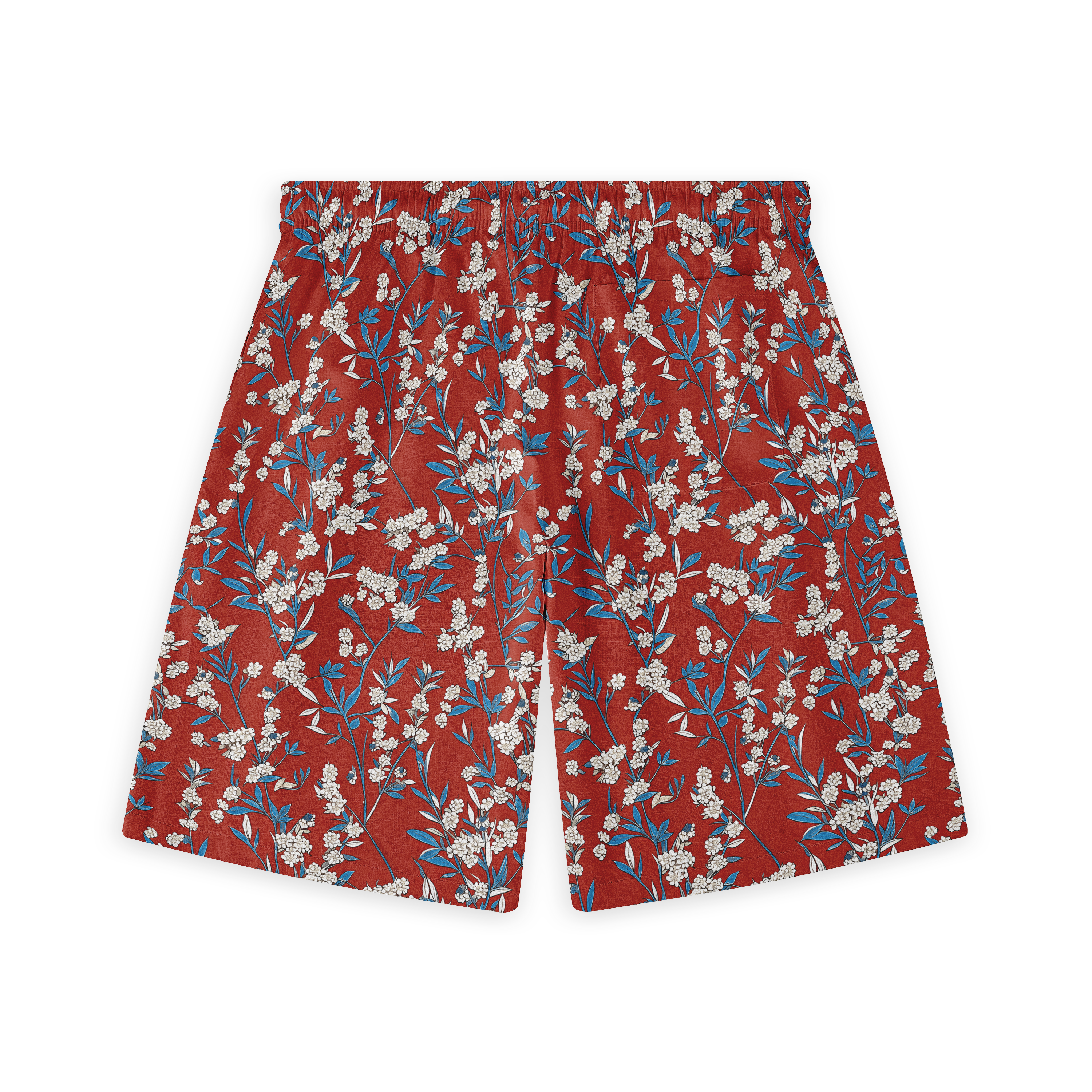 A pair of shorts featuring a floral design with delicate white blossoms and blue leaves set against a rich red background, creating a vibrant and harmonious pattern.