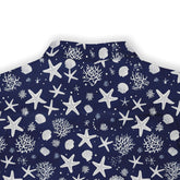 Marine-inspired pattern on a navy Hawaiian shirt by Kalvero, highlighting starfish and coral.