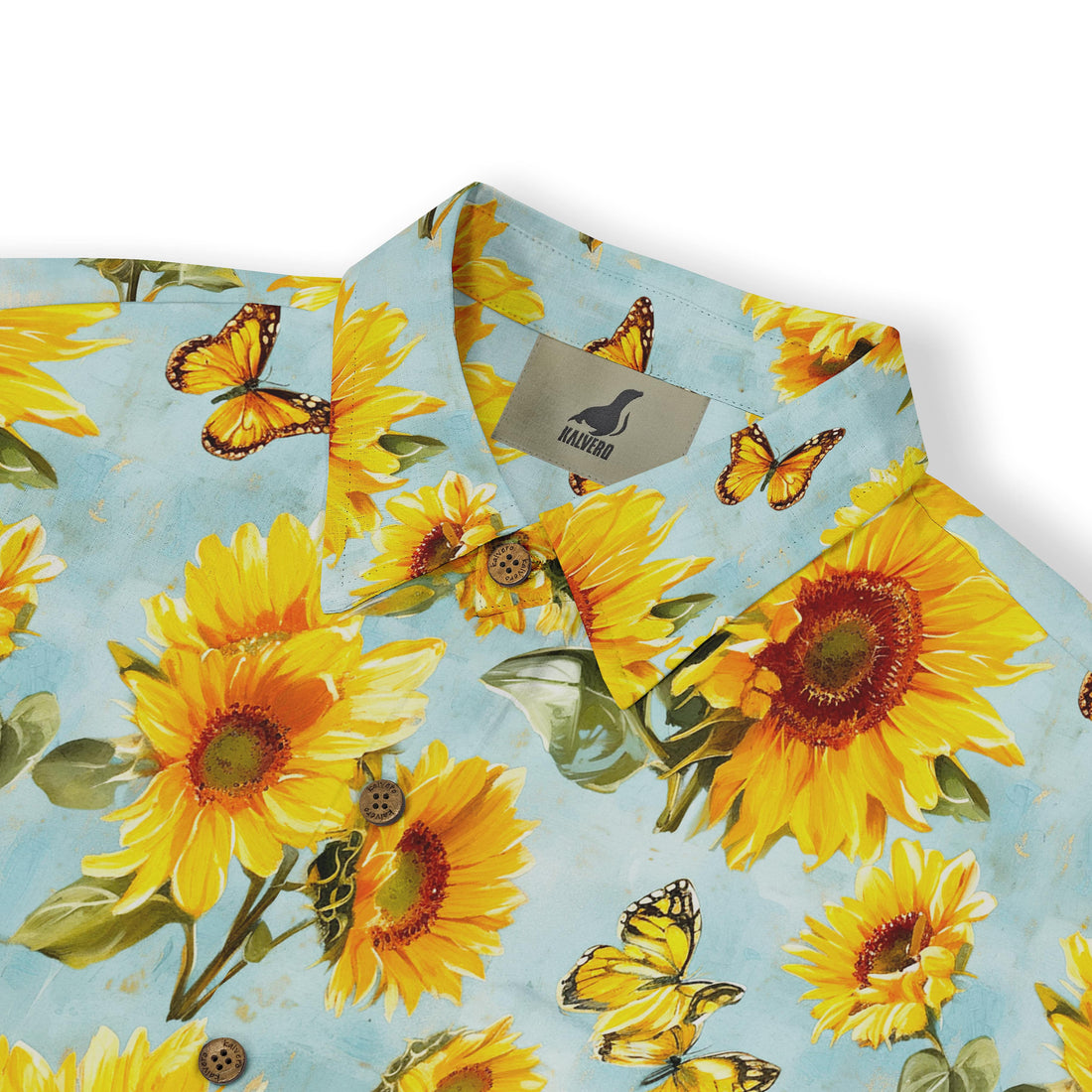 Vibrant sunflower and butterfly print on a light blue shirt.