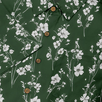 Green shirt with white floral print and wooden buttons.