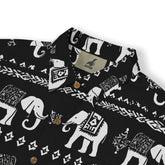 Detailed view of a tribal elephant design on a short-sleeve shirt.