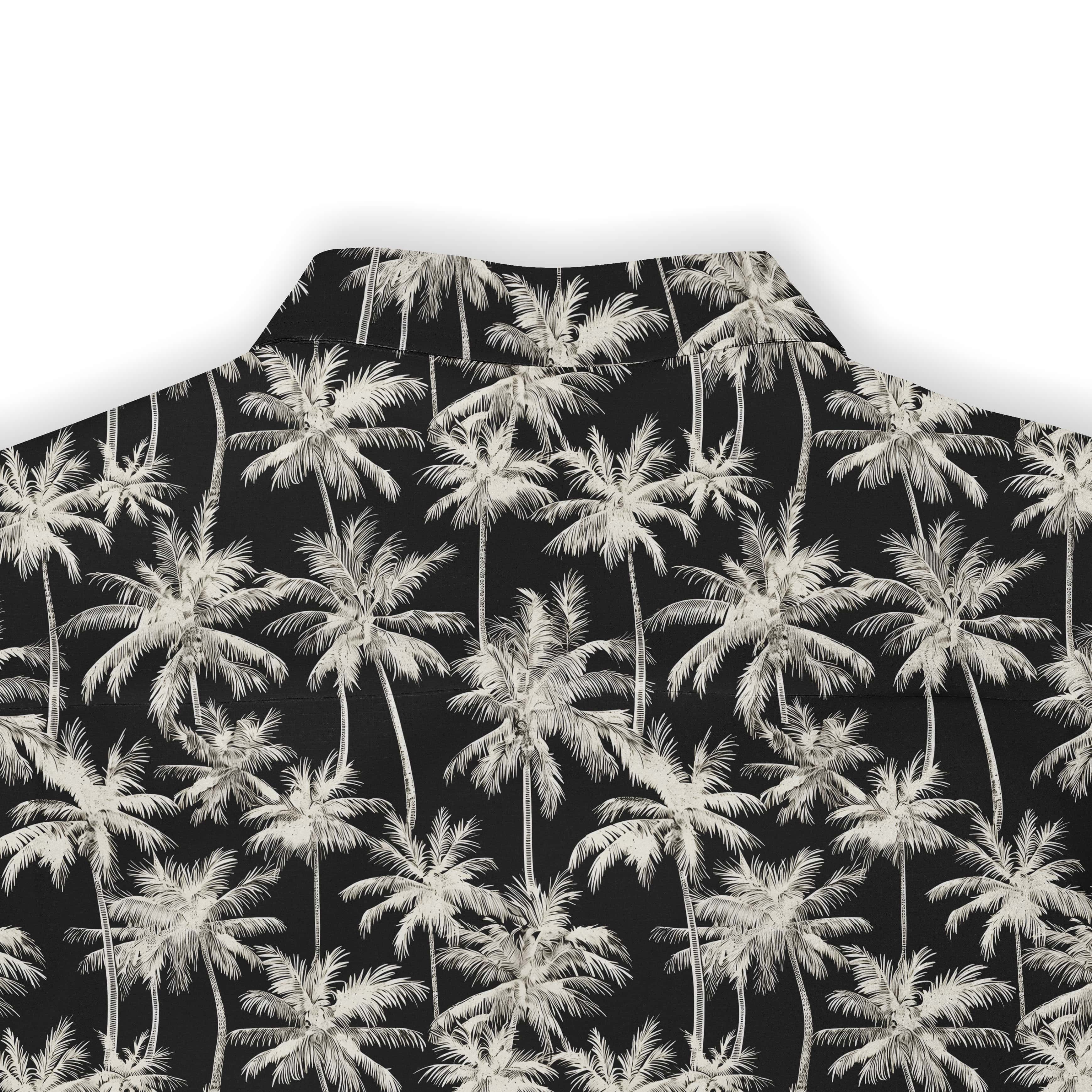 White palm tree pattern on a black shirt, capturing the essence of tropical relaxation.