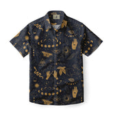 A dark short-sleeve shirt with mystical gold symbols, including eyes, hands, snakes, and celestial patterns.