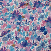 Colorful shirt featuring detailed coral reef and marine life designs in shades of blue, pink, and purple front buttons close-up