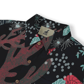 Black shirt with vibrant floral and leaf patterns, featuring wooden.