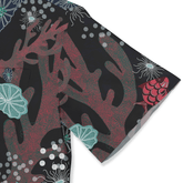 Black fabric with vibrant red coral, teal shells, and pink fish.