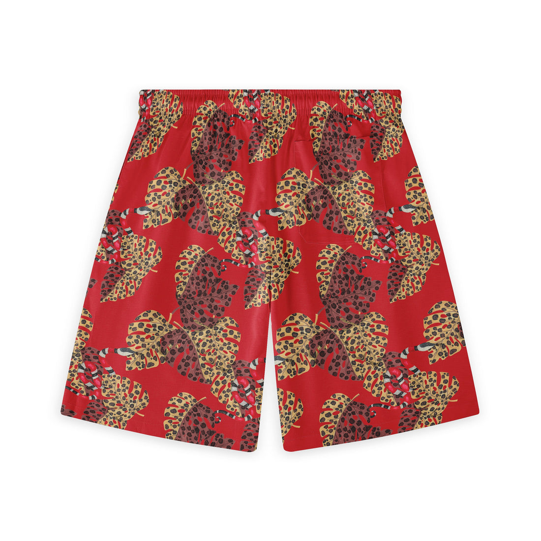 Red shorts with a vibrant tropical leaf pattern featuring leopard.