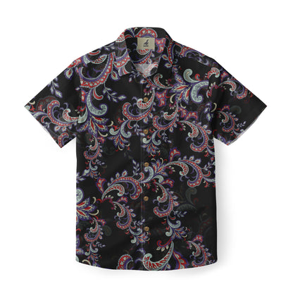 A short-sleeved shirt with an intricate paisley pattern in shades of red, blue, and green on a black background. The design is ornate, featuring swirling floral elements and rich detailing throughout.