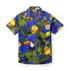 A Hawaiian shirt featuring a vibrant blue background with tropical elements, including pineapples, coconuts, palm leaves, and toucans.