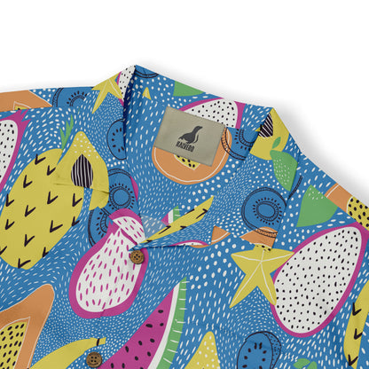 Close-up of a Hawaiian shirt collar showing a colorful print of tropical fruits like pineapples, papayas, and dragon fruits on a bright blue background with a Kalvero label.