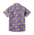 Purple shirt with yellow and green citrus slice pattern.