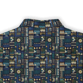 A short-sleeved shirt with an intricate geometric pattern in deep blues, greens, and golds. back view