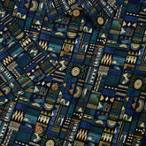 Blue patterned fabric with geometric designs and buttons.