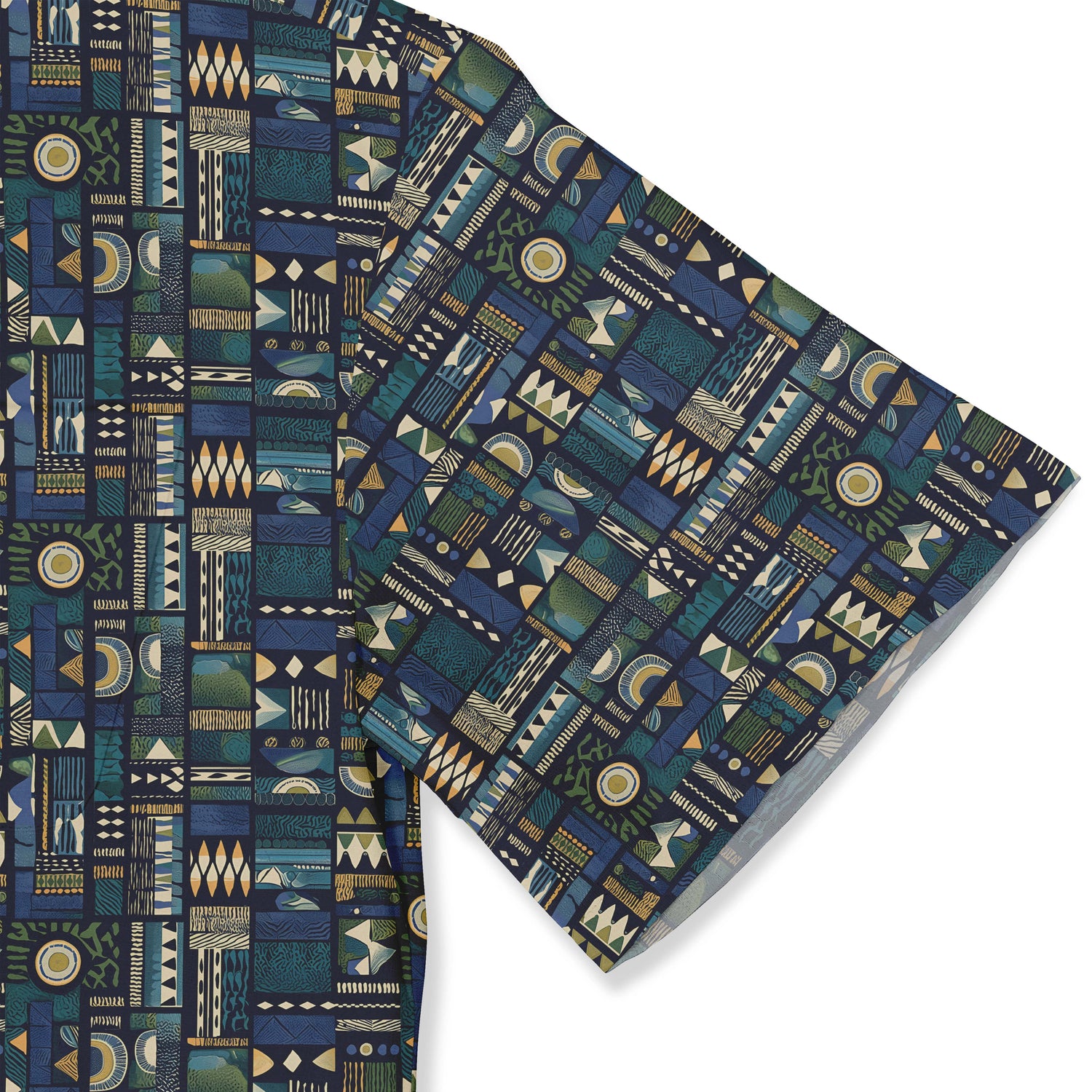Blue fabric with geometric patterns in green, white, and gold.
