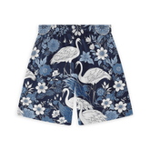 Floral patterned blue shorts with white cranes and intricate flowers in various shades of blue.