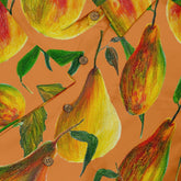 Close-up of a Hawaiian shirt with a vibrant pear design on an orange background.