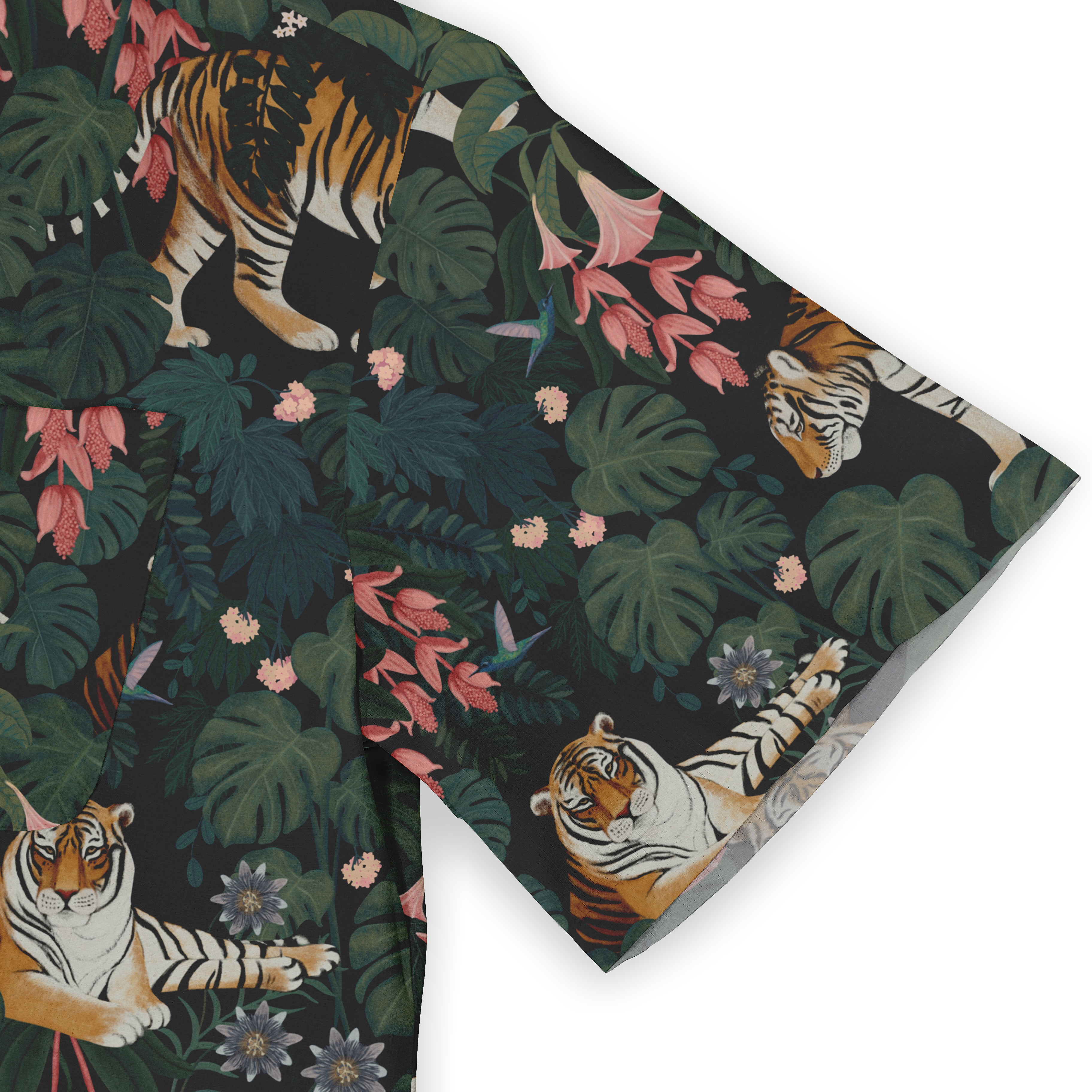 This image showcases the sleeve of the shirt, emphasizing the vibrant print of tigers surrounded by dense tropical foliage and pink blossoms, creating a striking and adventurous look.