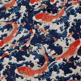 Red koi fish on blue waves fabric pattern.