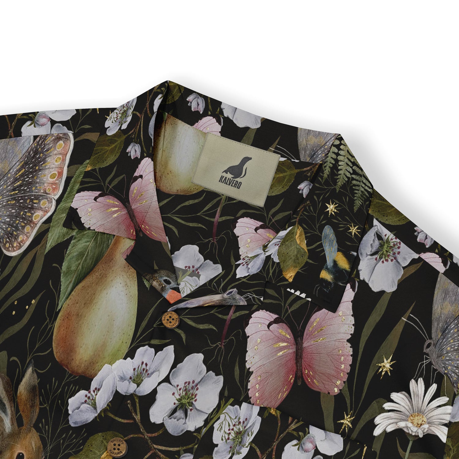 Close-up view of a shirt collar showcasing a whimsical design with butterflies, blossoms, and a pear on a dark background, featuring the Kalvero brand tag.