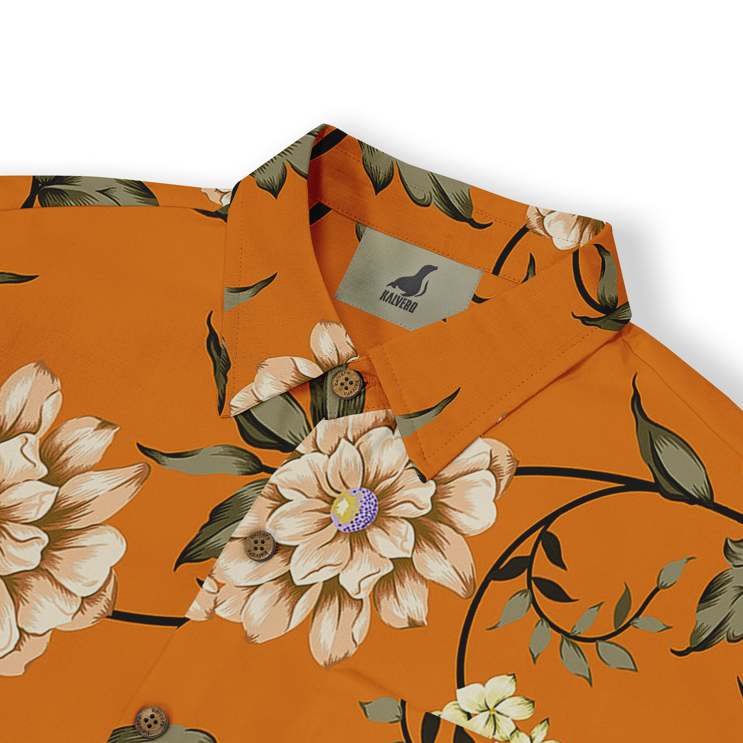 Close-up view of a shirt collar with a floral design featuring white and beige flowers with green leaves on an orange background. The shirt label shows the brand &quot;Kalvero.&quot;