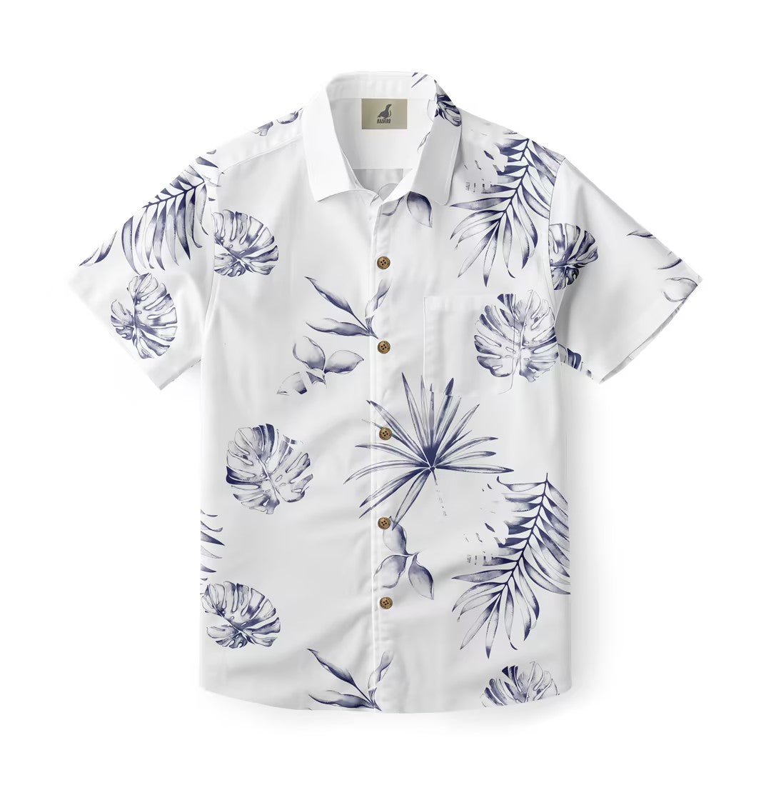 White short-sleeve shirt with blue tropical leaf print and wooden.