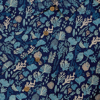 Blue shirt with coral and seaweed print, button-up design.